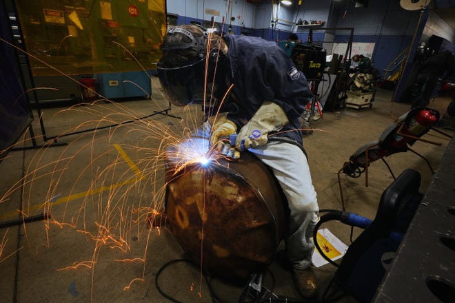 Voc-Tech students work on metal sculptures to be displayed at zoo